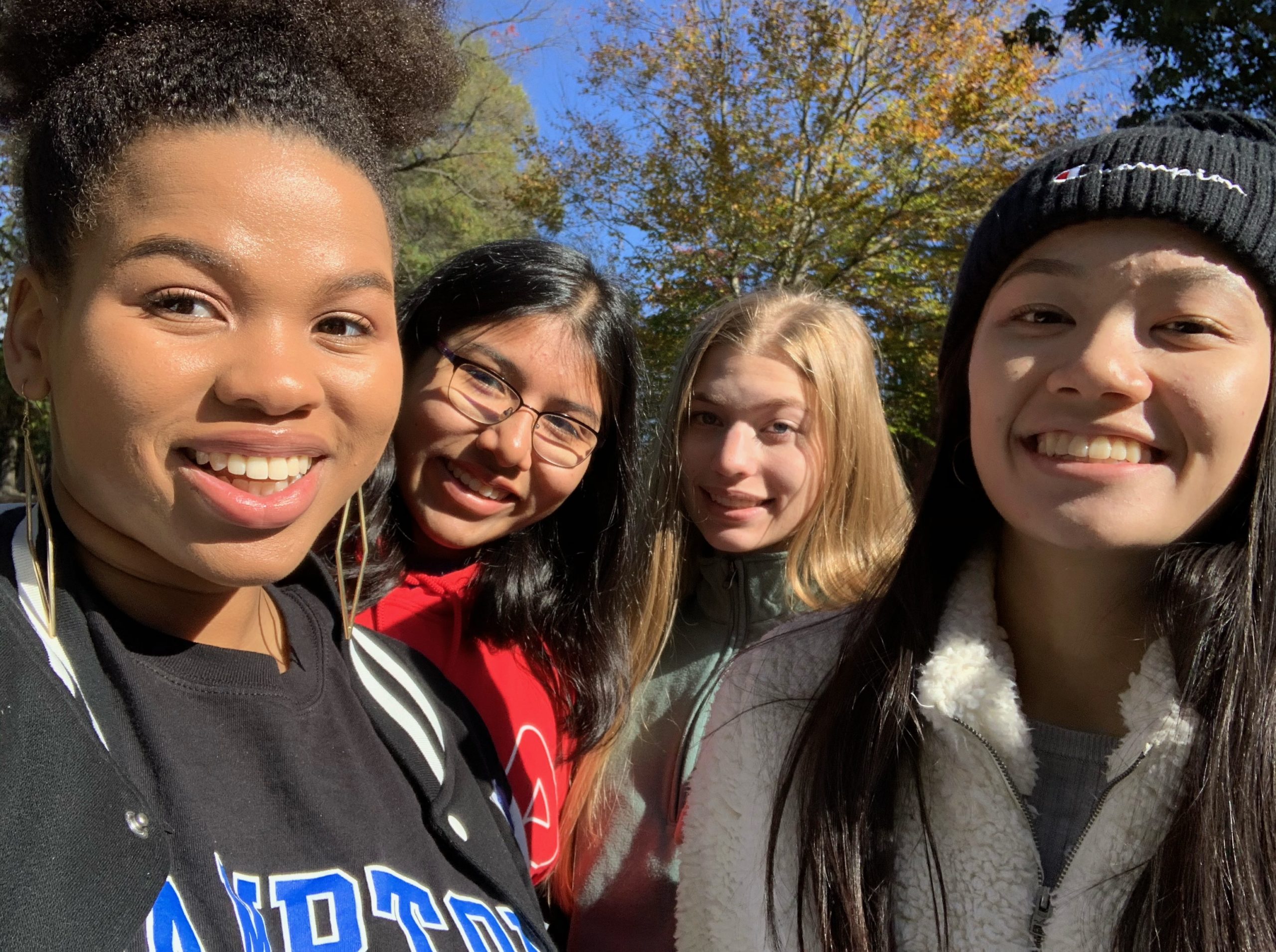 close up of the faces of four students